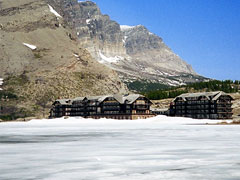Still Frosen Swiftcurrent Lake in front of Many Glacier Hotel