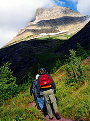 The Hikers and The foothill of Mt.Wilbur,
    on Swiftcurrent Pass Trail