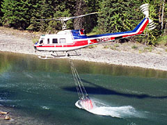 Firefighter Helicopter Scoops up Water